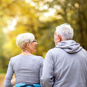 Mature Couple Man And Woman Jogging In The Park